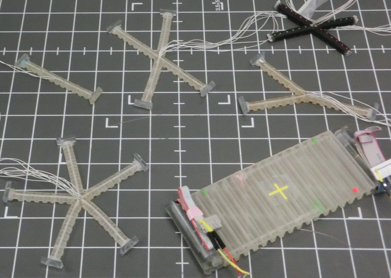 6 different kinds of soft robots on a work mat